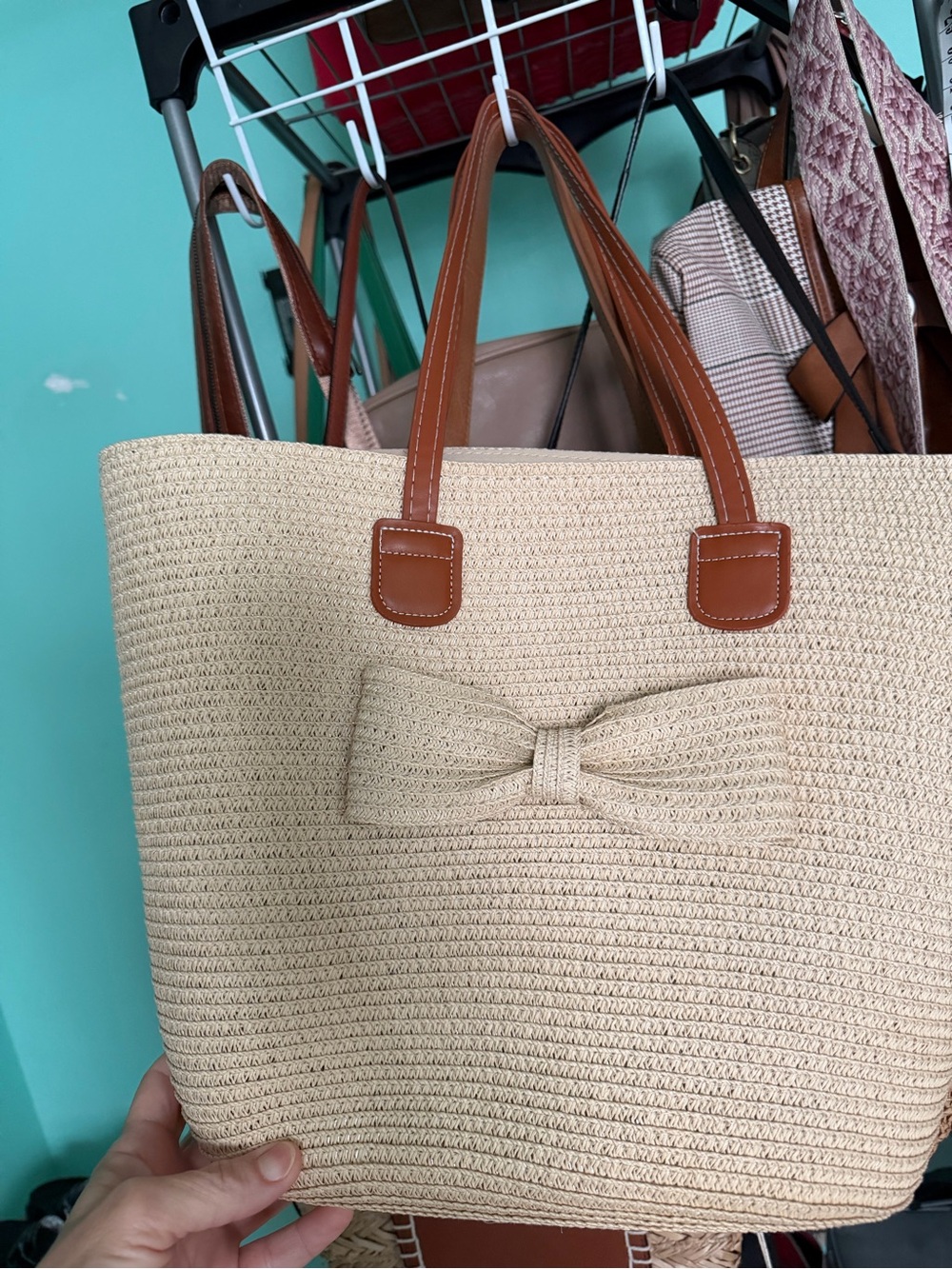 Neutral Straw Tote with Brown Faux-Leather Handles and Decorative Bow